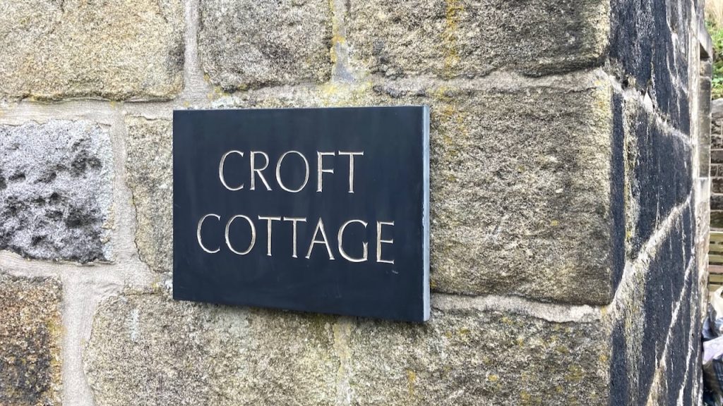 house sign carved in slate with gold leaf lettering